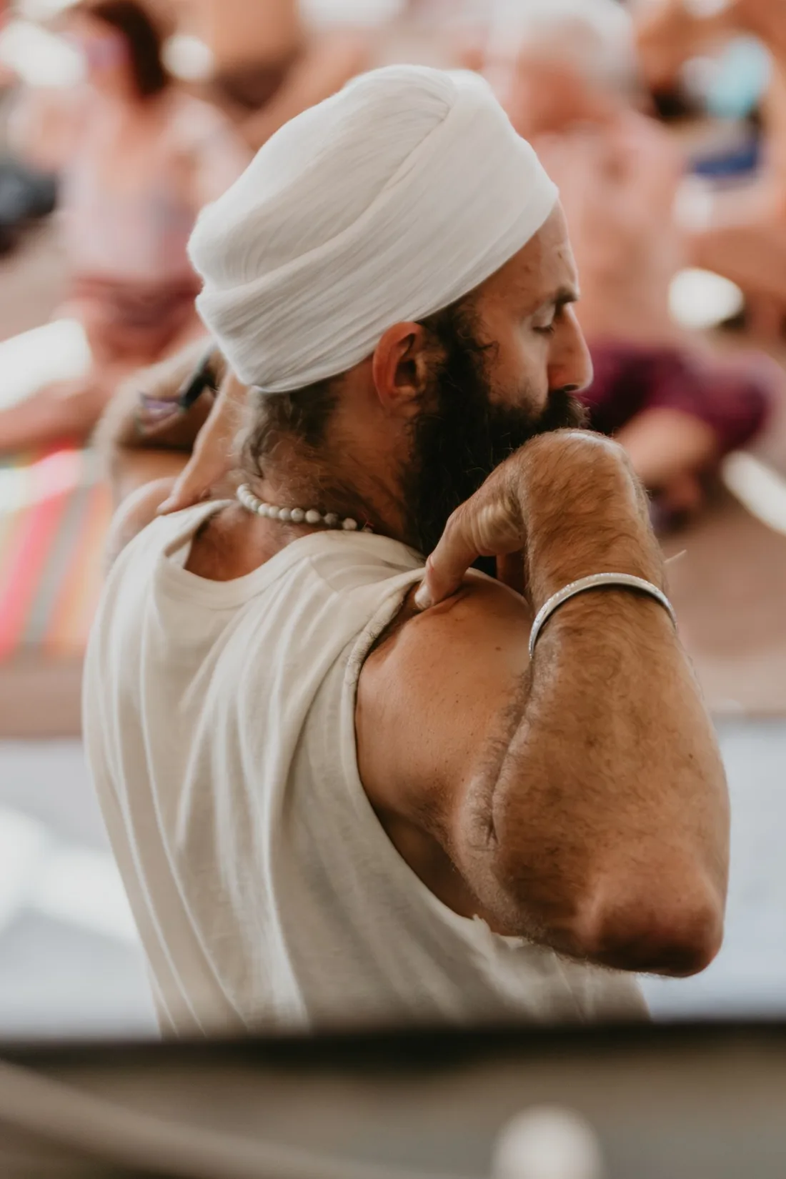 Jai Dev practicing Kundalini Yoga with a group.